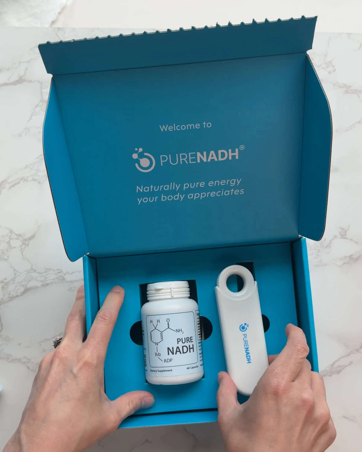 Opening the PureNADH welcome box: the bottle and the travel pill case